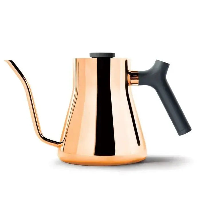 Copper stovetop kettle with black ergonomic handle and gooseneck spout for pour-over coffee