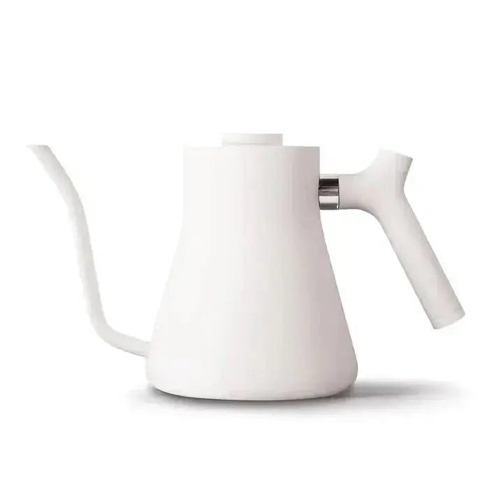 White stovetop pour-over kettle with a gooseneck spout and ergonomic handle